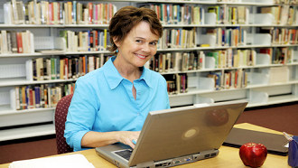 woman on laptop at library