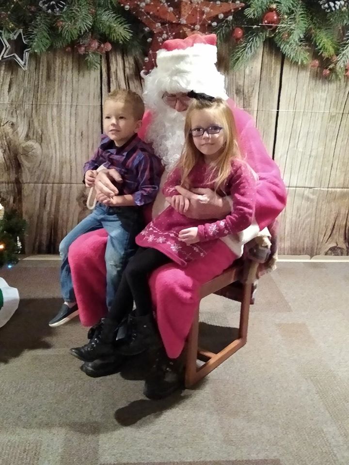 Santa visiting with families